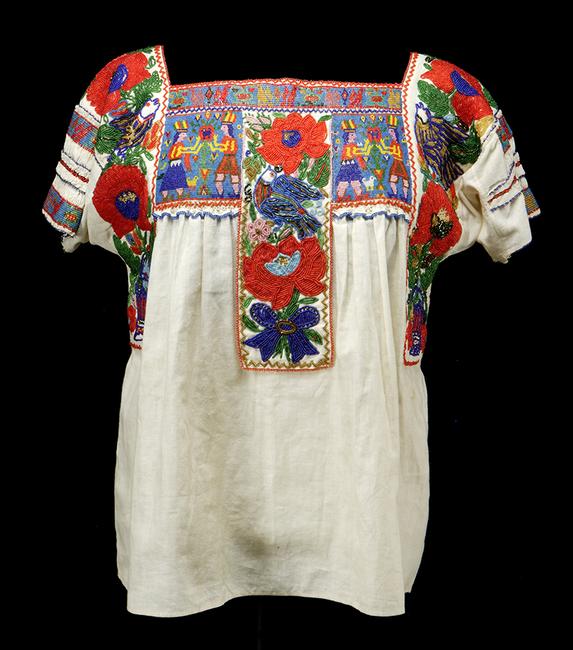 China poblana blouse, c.  1935 Puebla city and state, México Cotton, glass beads, 24 ½ x 21 1/16 in.  (62.25 x 53.5 cm.) Gift of Florence Dibell Bartlett, Museum of International Folk Art, A.1955.1.135 Photograph by Addison Doty