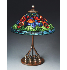 Tiffany Studios table lamp with 20in conical leaded-glass shade in ‘Poppy’ motif exhibiting the very highest standards of Tiffany artistry.  Astounding colorway and complex composition.  Exceptionally rare base with 16 iridescent Favrile-glass balls as supports for the telescoping stem.  Tiffany stamps to both shade and base.  Estimate $350,000-$450,000 