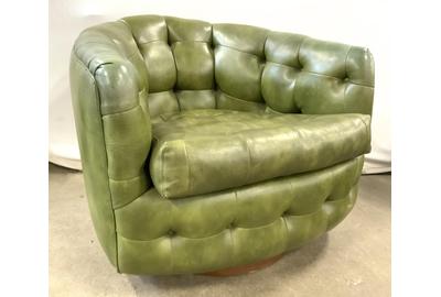 Leading Midcentury Modern furniture offerings is this pair of Thayer Coggin tufted barrel back chairs ($500-3,000) in a pleasing green leather, 25 by 30 inches.