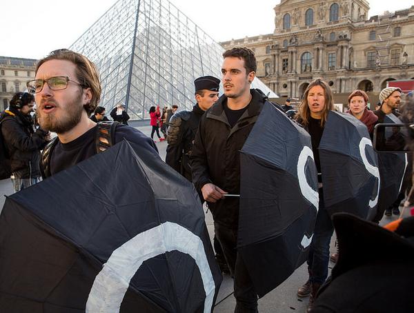 Artists and activists protest oil company sponsorship outside the Louvre on Dec.  9, 2015.