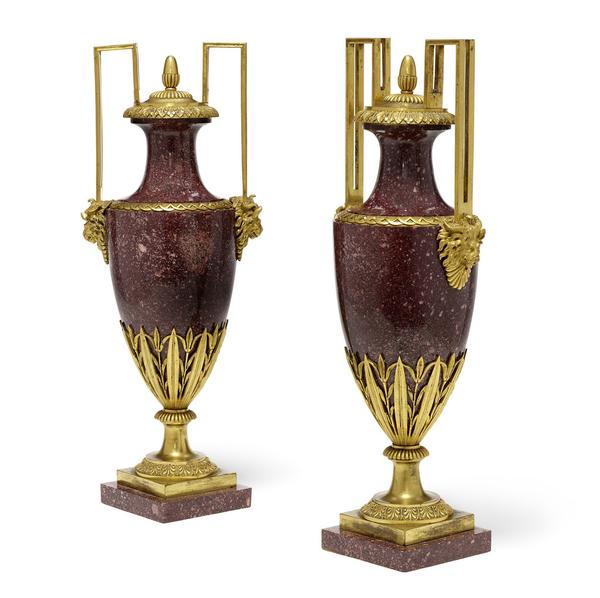 A pair of good quality Louis XVI style gilt bronze mounted porphyry covered urns, 19th century (estimate: $8,000 - 12,000)