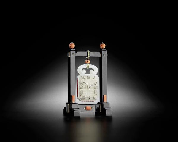 Cartier.  A very fine diamond-set jade, onyx, coral, beryl and gold Chinoiserie desk clock (estimate: $40,000 - 60,000)