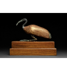 Ancient Egyptian sculpted gilt wood and bronze ibis, circa 664-32 BC, Late Period to Ptolemaic Period, of a type often formed as coffins for mummified ibises.  Size: 190mm x 250mm.  Provenance: private London collection; ex Attal collection, Austin, Texas; via family descent from great uncle, initially acquired in first half of 20th century.  Estimate £10,000-£20,000 