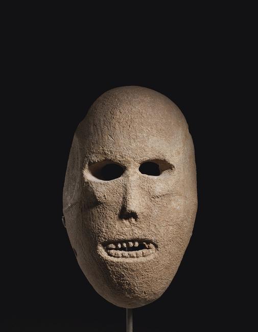 A JUDEAN DESERT LIMESTONE MASK, PRE-POTTERY NEOLITHIC B circa 7th millennium B.C.  