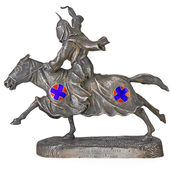 Lot 2593, "The Birth of a Nation" Sterling Statuette.  Mounted Ku Klux Klansman commemorating the silent film "The Birth of a Nation," ca.  1915, Estimate: $5,000-7,000.  Engraved, “The Clansman" and “To David Wark Griffith in Appreciation from Robert Goldstein".  Note: D.W.  Griffith was the director of “The Birth of a Nation" and Robert Goldstein supplied the costumes.  “The Clansman" is the name of the book on which “The Birth of a Nation" was based.