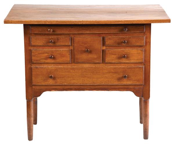 Circa-1840 Shaker dropleaf sewing table composed of butternut, cherry, pine and possibly basswood.  Probably from the Shaker community of Hancock, Massachusetts; attributed to family elder David Terry.  Attracted 69 bids and sold for $98,400 against an estimate of $5,000-$10,000