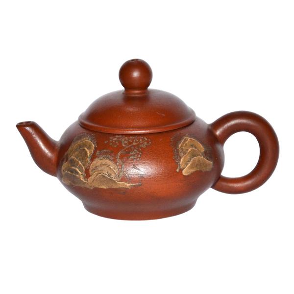 One of two mountainous landscape Zisha teapots by Ming master Hui Meng Chen’s in Gianguan Auctions December 9, 2017 sale.  