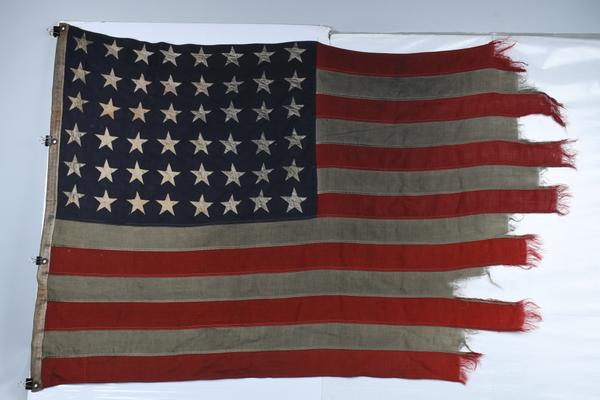 Omaha Beach D-Day American Flag flown on the mast of LCI (Landing Craft Infantry) (L)-413, which brought ashore the valiant 115th Infantry Regiment on June 6, 1944.  Extensive provenance.  Estimate $50,000-$60,000