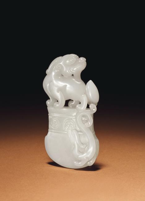 A Fine White Jade Axe-Form Pendant, 18th/19th Century Estimate: $10,000-15,000 