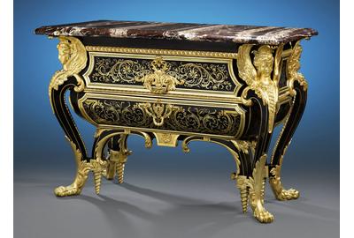 Henry Dasson based this commode upon the famous pair Boulle created for Louis XIV.  