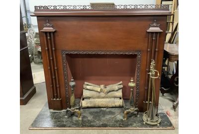 This RCA Victor fireplace radio ($500-1,500) comes with a set of fireplace tools and accessories.  It measures 50 by 60 by 25 inches.