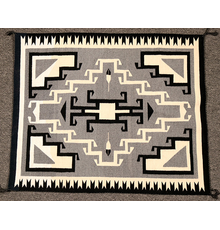 Exquisite Toadlena Two Grey Hills (New Mexico) weaving, 42 inches by 36 inches, in excellent condition, with the four corners hooked, as is the center diamond (est.  $1,500-$3,000).