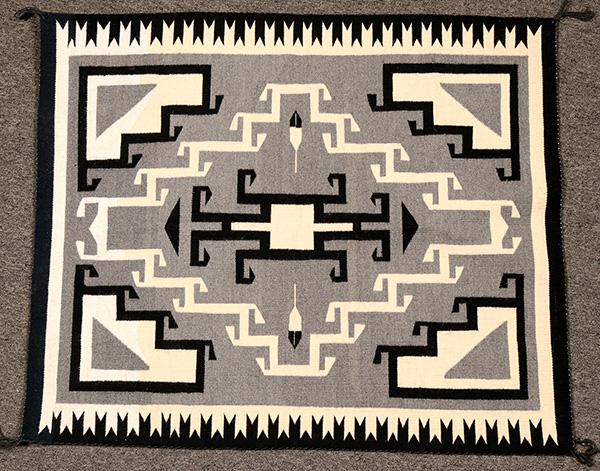 Exquisite Toadlena Two Grey Hills (New Mexico) weaving, 42 inches by 36 inches, in excellent condition, with the four corners hooked, as is the center diamond (est.  $1,500-$3,000).