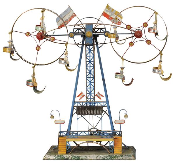 Mohr & Krauss double Ferris wheel, 25in to top of tower.  Painted tin with all original composition figures intact.  Book example shown in David Pressland’s quintessential reference ‘The Art of the Tin Toy.’ Sold to a European bidder for $132,000 against an estimate of $10,000-$15,000