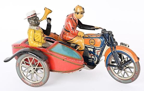 Paya tin windup motorcycle with sidecar, 11 inches long, Spanish, rare, all-original and complete example with working bellows.  Estimate: $3,000-$5,000