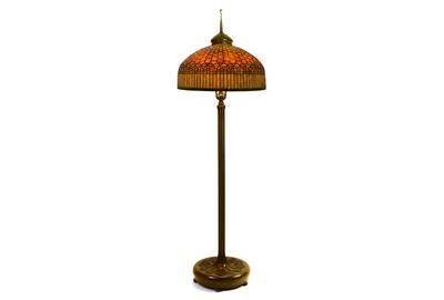 A circa 1910 Tiffany Studios “Curtain Border” floor lamp ($80/120,000), in leaded glass and patinated bronze, 78½ inches tall, with its shade impressed “Tiffany Studios, New York, 5364” will lead a parade of Tiffany lamps across the block.