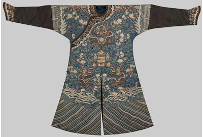 BLUE SILK METALLIC THREAD EMBROIDERED NINE DRAGON ROBE, early 19th century; decorated with conch shells, lotus flowers, fish, sacred vases, tasseled canopy, and other sacred symbols and motifs; estimate: $6,000-10,000 