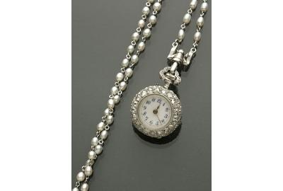 An Edwardian lady’s platinum, diamond and seed pearl pendant watch by Vacheron & Constantin took center stage and sold to a phone bidder for $28,200.