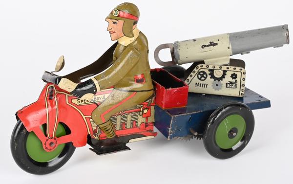 Louis Marx & Co.  (USA), prototype tin windup Speedboy 4 military motorcycle with spring-loaded military cannon and ammo box on back.  Hand-painted details to soldier and cannon.  Tied as top lot of the sale, selling for $22,800 against an estimate of $6,000-$8,000