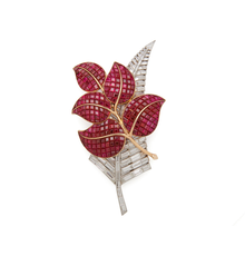 Lot 36: Van Cleef & Arpels Gold, Platinum, 'Mystery-Set' Ruby, and Diamond Leaf Brooch, SOLD $781,250