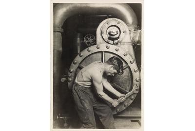 Lot 60: Lewis W.  Hine, Powerhouse Mechanic, silver print, circa 1921.  Estimate $70,000 to $100,000.