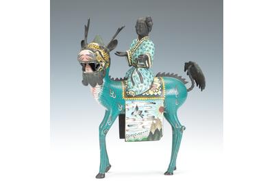 Lot 1306.  Cloisonne Figural of Quan Yin Riding a Qilin.  est $3,000-$5,000