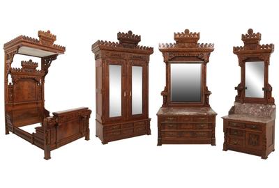 A massive Eastlake four-piece tester bedroom set ($8/12,000) includes a half tester bed, armoire, marble top dresser and commode with mirror, all ornamented with pierced carved crests having a central medallion, stylized birds, lion heads and all-over floral decoration.