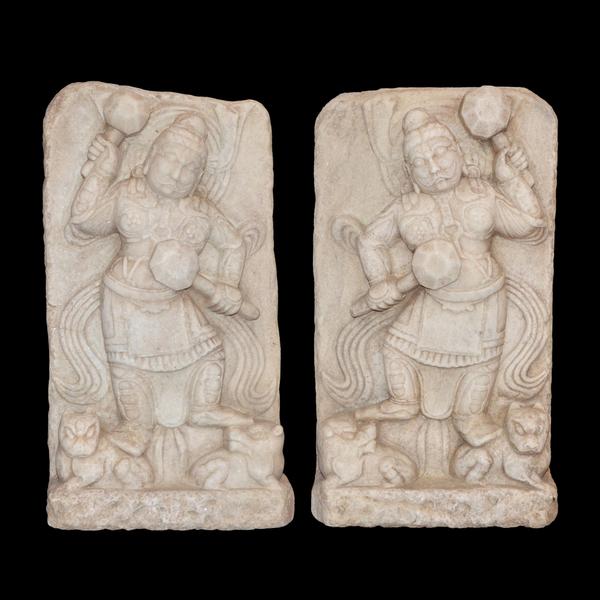 Chinese marble stelae, with high relief guardians clenching clubs and trampling beastly demons.  Lot 75, Gianguan Auctions, December 9, 2017 