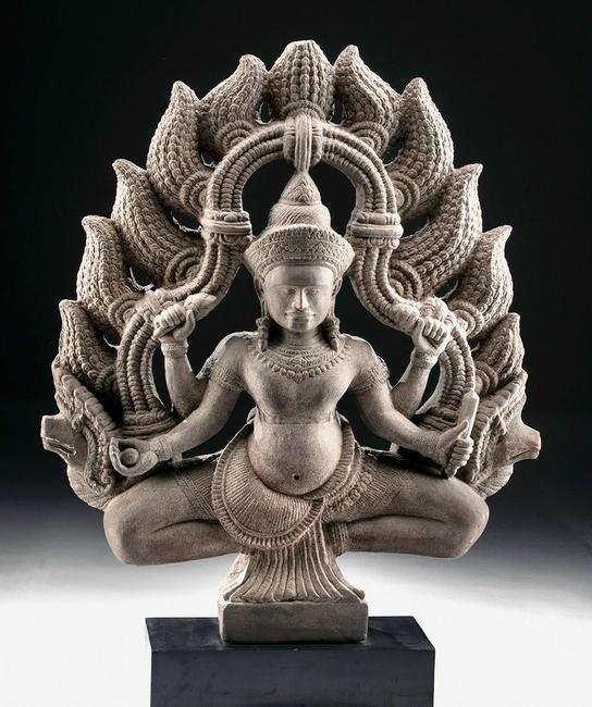 Superb 8th-12th century Khmer (Cambodia, Angkor culture) stone statue of Hindu god Shiva, buff grey sandstone, 30in high.  Estimate $16,000-$24,000