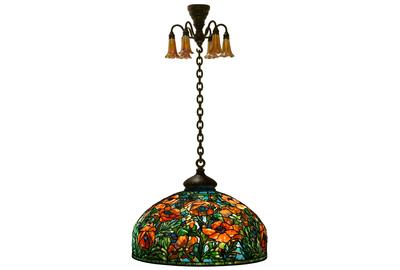 Expected to lead the auction is this 1902-signed Tiffany Studios Oriental Poppy chandelier ($400/600,000) having a leaded glass shade decorated with red-orange Oriental poppy flowers rising out of green stems, set against a blue background, 50 by 26 inches.