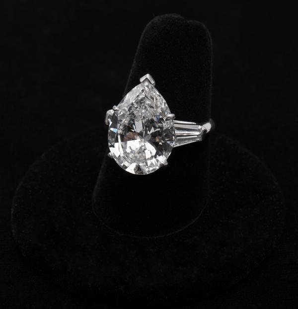 Lot 134: GIA certified 9.19 cts.  pear-shape diamond ring.  Est.  $75,000-100,000