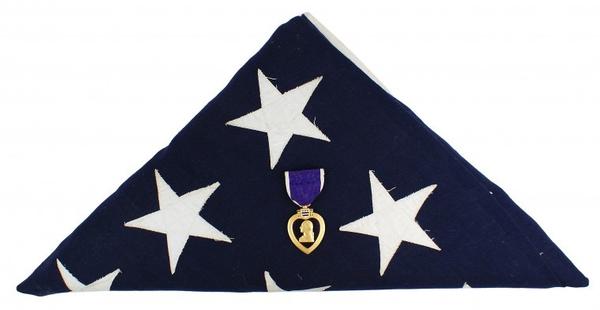 This Purple Heart, awarded to U.S.  Cpl.  Joseph E.  Oleskiewicz for valor shown on June 6, 1944 in Normandy, France, sold for $5,100 at the Dec.  5-6 auction.