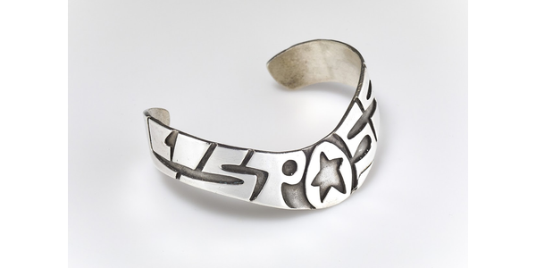 "All Is Possible" sterling silver cuff with star.  From the collection of Suijin Li Snyder.  Photo by Jason Dowdle.