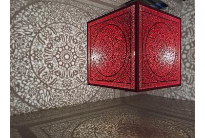 Anila Quayyum Agha (b.  1965), All the Flowers Are for Me (Red), laser-cut lacquered steel and lightbulb, 60x60x60 in, Alice Bimel Endowment for Asian Art, 2017.7