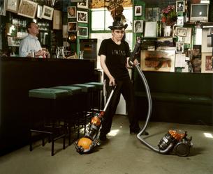 Amelia Troubridge, Michael Wojas hoovering at The Colony Rooms, 2008, Giclée digital archival print, 16 x 12 in.  © Amelia Troubridge.  Courtesy of Dellasposa Gallery