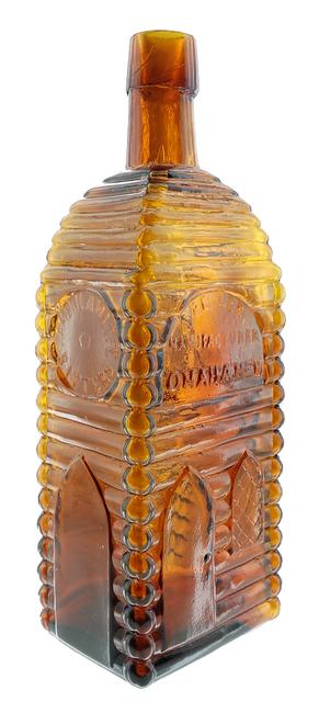 American Life Bitters bottle (Peiler Manufacturer, Omaha, Neb.) with applied top, a rare cabin-shaped bottle in near-perfect 9.5 condition, expected to sell for $7,000.