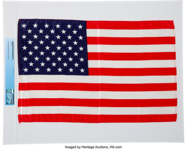 The Largest Size American Flag, measuring 17-3/4 inches by 11-1/2 inches, Armstrong kept as a treasured Apollo 11 souvenir, sold for $275,000.