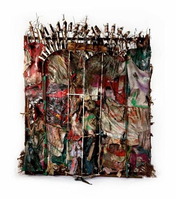 Thornton Dial (American, 1928-2016).  History Refused to Die, 2004.  Okra stalks and roots, clothing, collaged drawings, tin, wire, steel, Masonite, steel chain, enamel, spray paint, 8 ft.  6 in.  x 87 in.  x 23 in.  (259.1 x 221 x 58.4 cm).  The Metropolitan Museum of Art, New York, Gift of Souls Grown Deep Foundation from the William S.  Arnett Collection, 2014.  © Thornton Dial