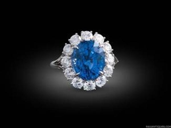 A brilliant blue 8.82-carat oval sapphire surrounded by 1.99 carats of fiery diamonds in a classic platinum mounting ($45,000).