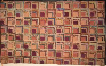 Corners Log Cabin pattern in terracotta, wine, sand and rose shades.