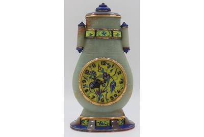 This fine jade, lapis, and enamel clock ($80/120,000), ex-Sotheby’s and attributed to Cartier, features a beautifully-incised archaistic style jade vase with tube form handles and gold mounts.