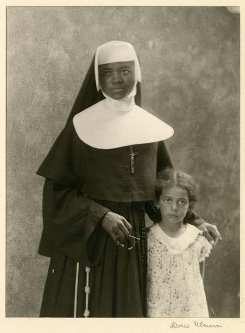 Doris Ulmann (American, 1882–1934), “Member of the Order of Sisters of the Holy Family and Child (Probably a Student), New Orleans, LA,” December 1931.  Posthumous gelatin silver print, printed by Samuel Lifshey, ca.  1934–37, 8 x 6 inches.  Berea College and the Doris Ulmann Foundation, 3406.