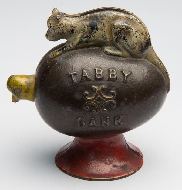 Tabby cast iron mechanical bank, embossed "Tabby Bank" with nodding chick, original paint.  J.  & E.  Stevens & Co.  Fourth quarter 19th century.  Sold for $5,750 against $300-500 estimate.  