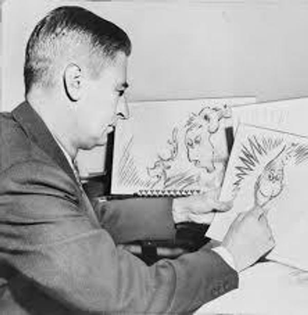 Theodor Seuss Geisel, "Dr.  Seuss," at work in 1957.