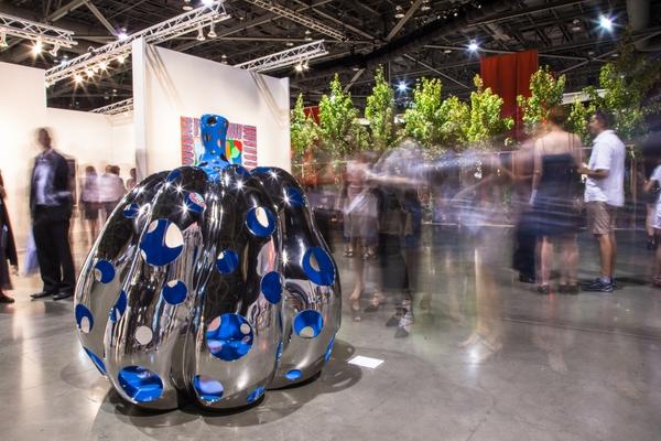 Sculpture (foreground) by Yayoi Kusama, 2015 edition of Seattle Art Fair.  Photo, Seattle Met.  