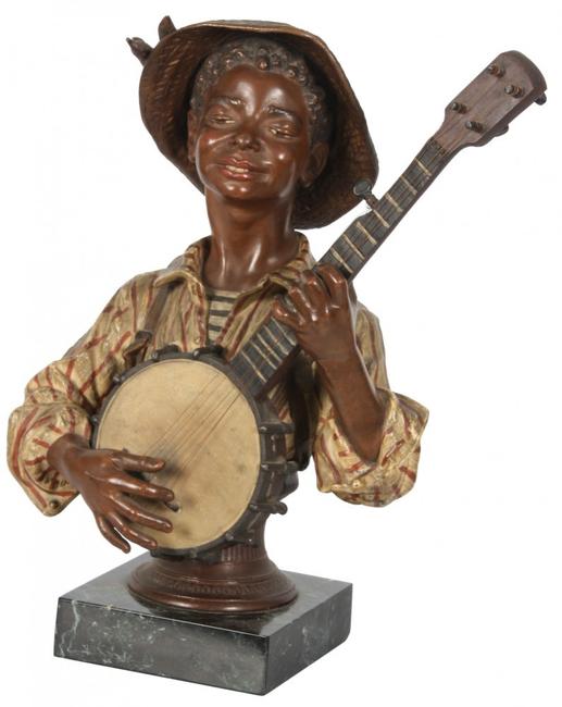 This cold painted figural bust of a black boy wearing a straw hat and 19th century French garb will be sold Saturday, September 13th.