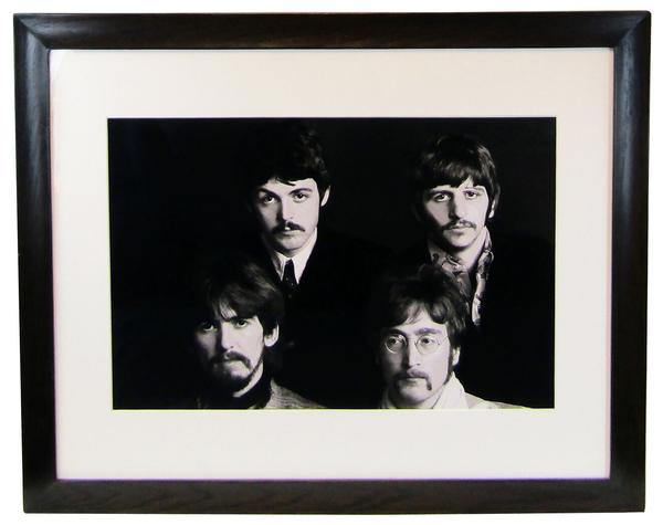 Large, glossy black and white photograph of all four Beatles, signed, inscribed, dated and numbered by French photographer Jean-Marie Périer (b.  1940) (estimate: $3,000-$4,000).  