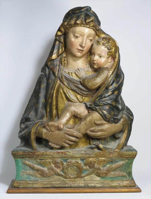 Lot 75.  School of Donatello, an important polychrome stucco relief of Madonna and Child, 36”tall.