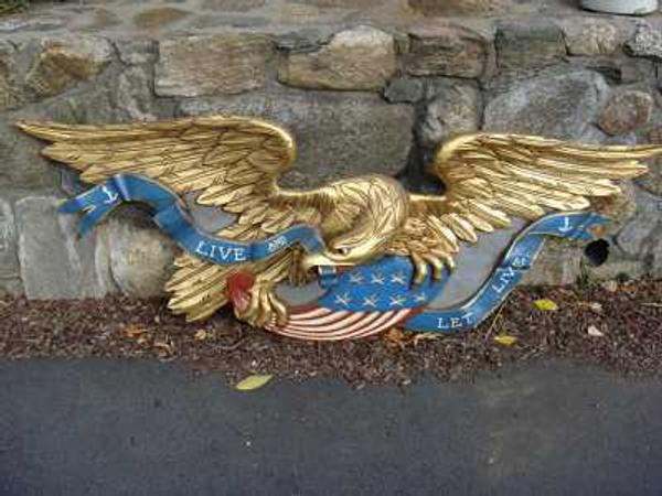 This carved eagle with gold gilt trim, made circa 1950s or '60s, sold for $8,100 at auction.