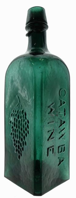 Catawba Wine bitters bottle with embossed grapes, circa 1860-1866, with overall crudity and pontiled variant, making it the finest example known ($18,400).